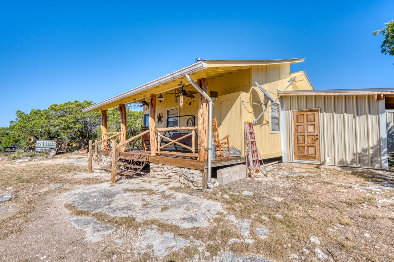 509 Pinon Loop East Camp Wood, TX 78833 - Photo 6 of 24 a view of wooden house with a yard
