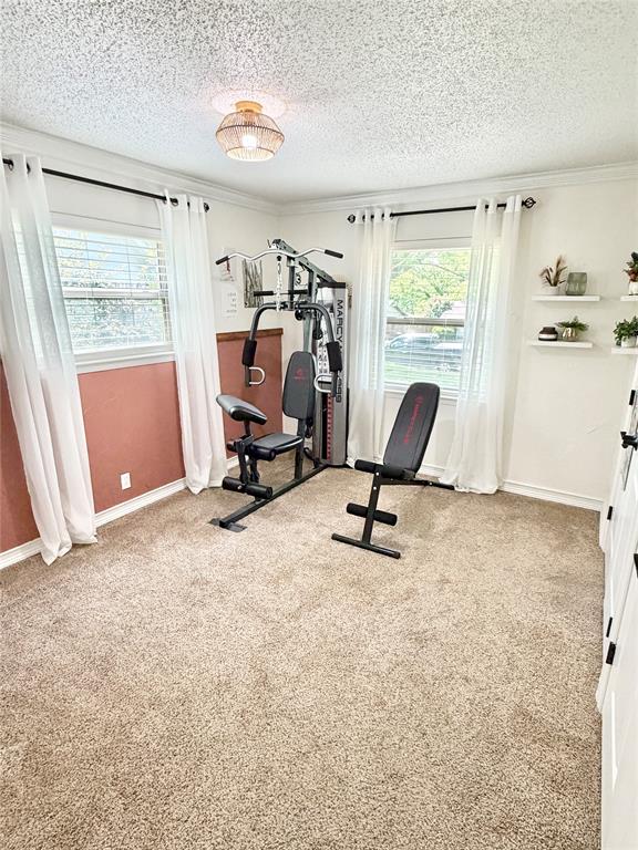806 Glen Key Street Denison, TX 75020 - Photo 15 of 27 a view of a workspace with furniture and a window