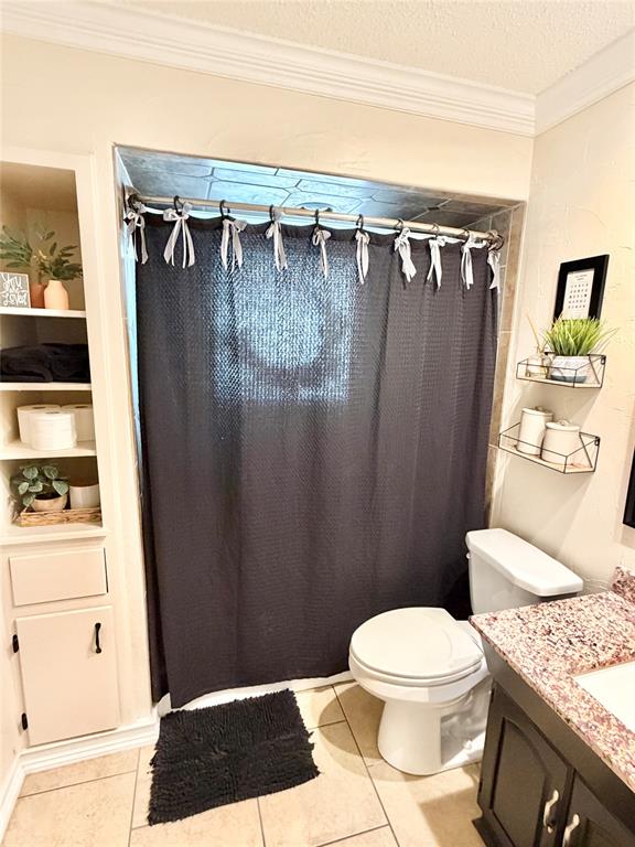 806 Glen Key Street Denison, TX 75020 - Photo 18 of 27 a bathroom with a granite countertop sink toilet and shower