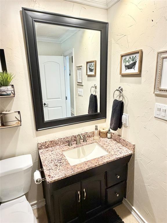806 Glen Key Street Denison, TX 75020 - Photo 20 of 27 a bathroom with a granite countertop sink and a mirror
