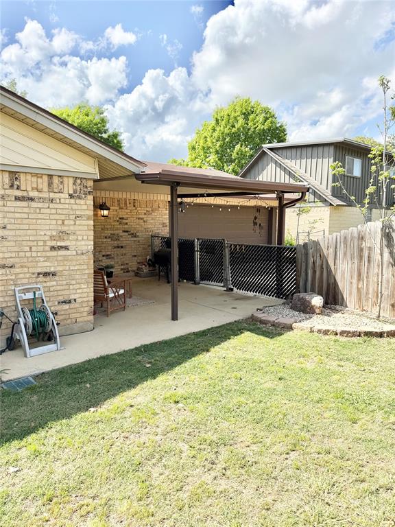 806 Glen Key Street Denison, TX 75020 - Photo 22 of 27 a view of a house with a backyard