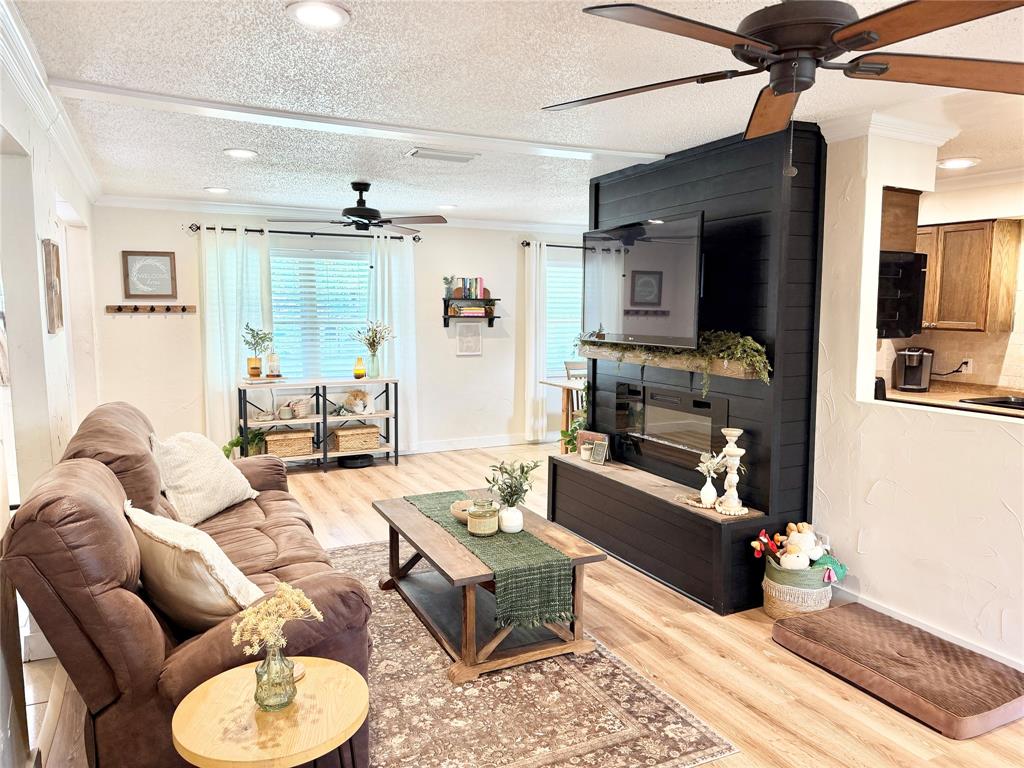 806 Glen Key Street Denison, TX 75020 - Photo 3 of 27 a living room with furniture and a flat screen tv