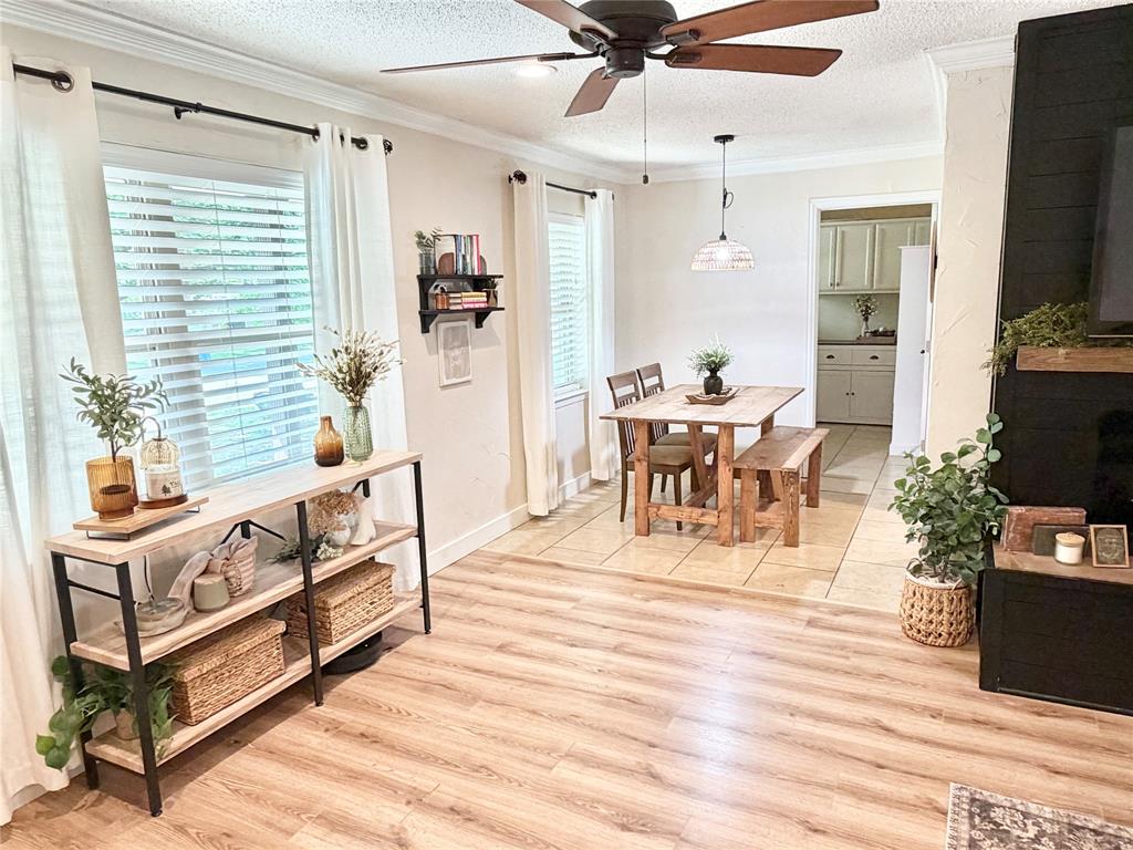 806 Glen Key Street Denison, TX 75020 - Photo 5 of 27 a living room with furniture a flat screen tv and a table