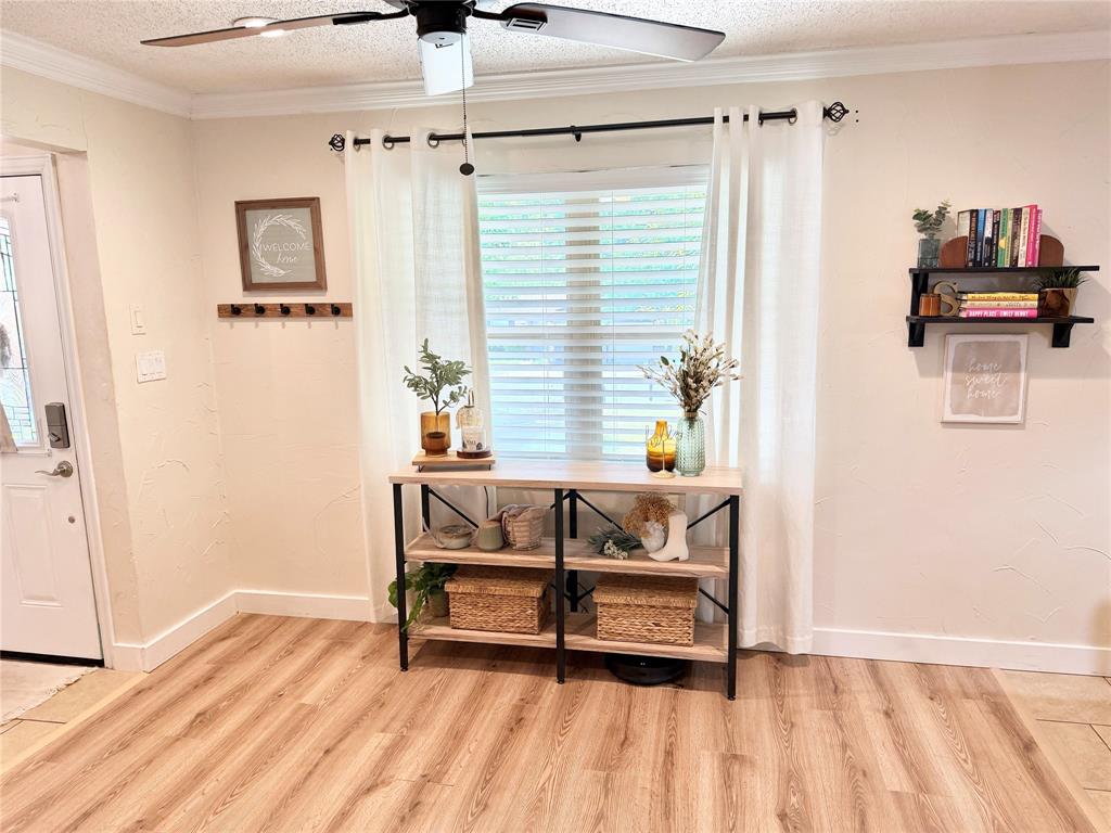 806 Glen Key Street Denison, TX 75020 - Photo 9 of 27 a view of a bedroom with furniture and a window
