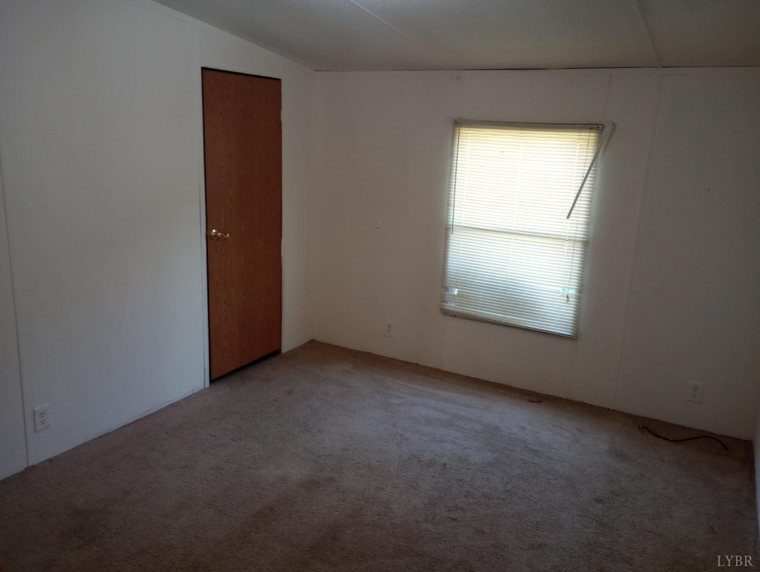 581 Red Oak School Road Rustburg, VA 24588 - Photo 12 of 17 an empty room with a window