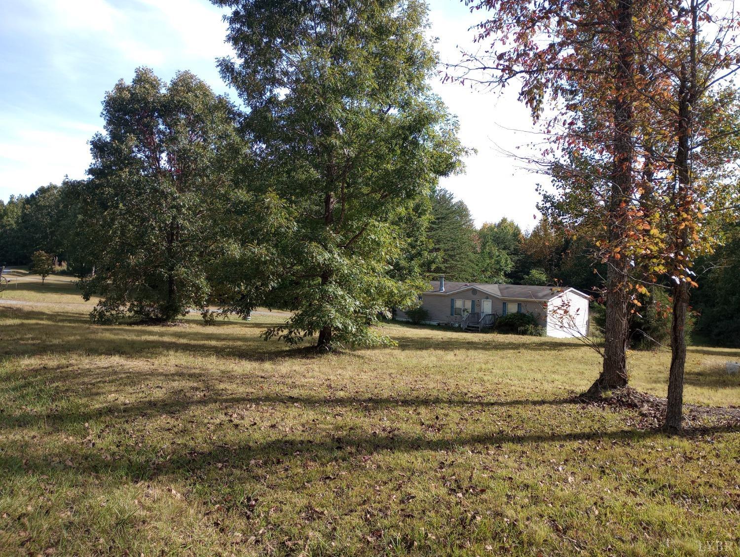 581 Red Oak School Road Rustburg, VA 24588 - Photo 17 of 17 a view of a yard with trees