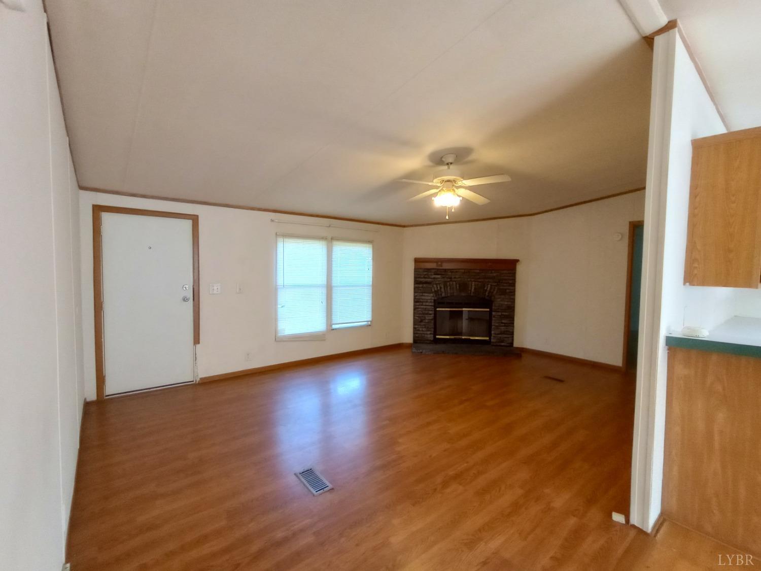 581 Red Oak School Road Rustburg, VA 24588 - Photo 2 of 17 a view of a livingroom with an empty space and a window