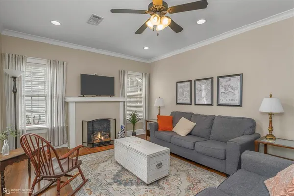 a living room with furniture and a fireplace