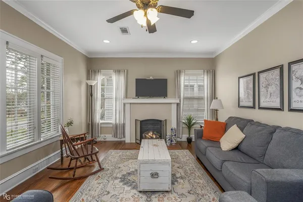 a living room with furniture fireplace and window
