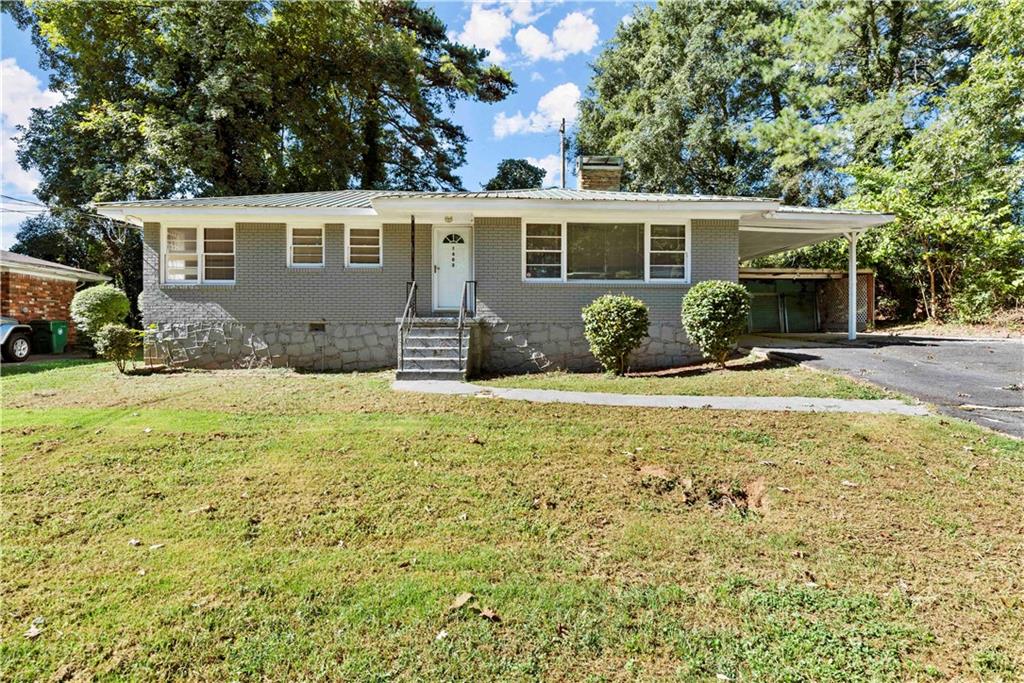 1403 Ruth Place Decatur, GA 30035 - Photo 1 of 1 a front view of a house with a yard