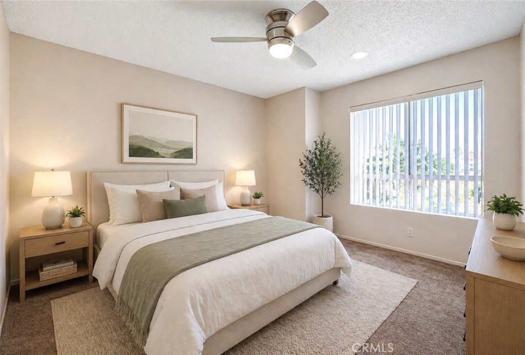 450 East 4th Street, Unit 337 Santa Ana, CA 92701 - Photo 11 of 26 a spacious bedroom with a large bed and a window