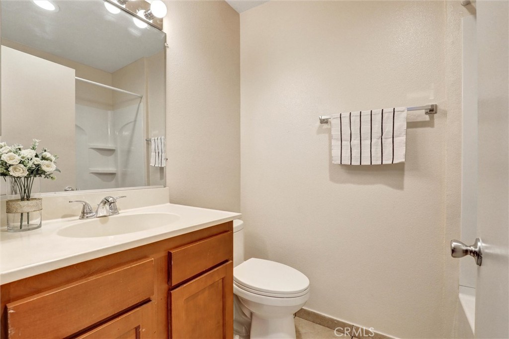 450 East 4th Street, Unit 337 Santa Ana, CA 92701 - Photo 12 of 26 a bathroom with a sink toilet and vanity
