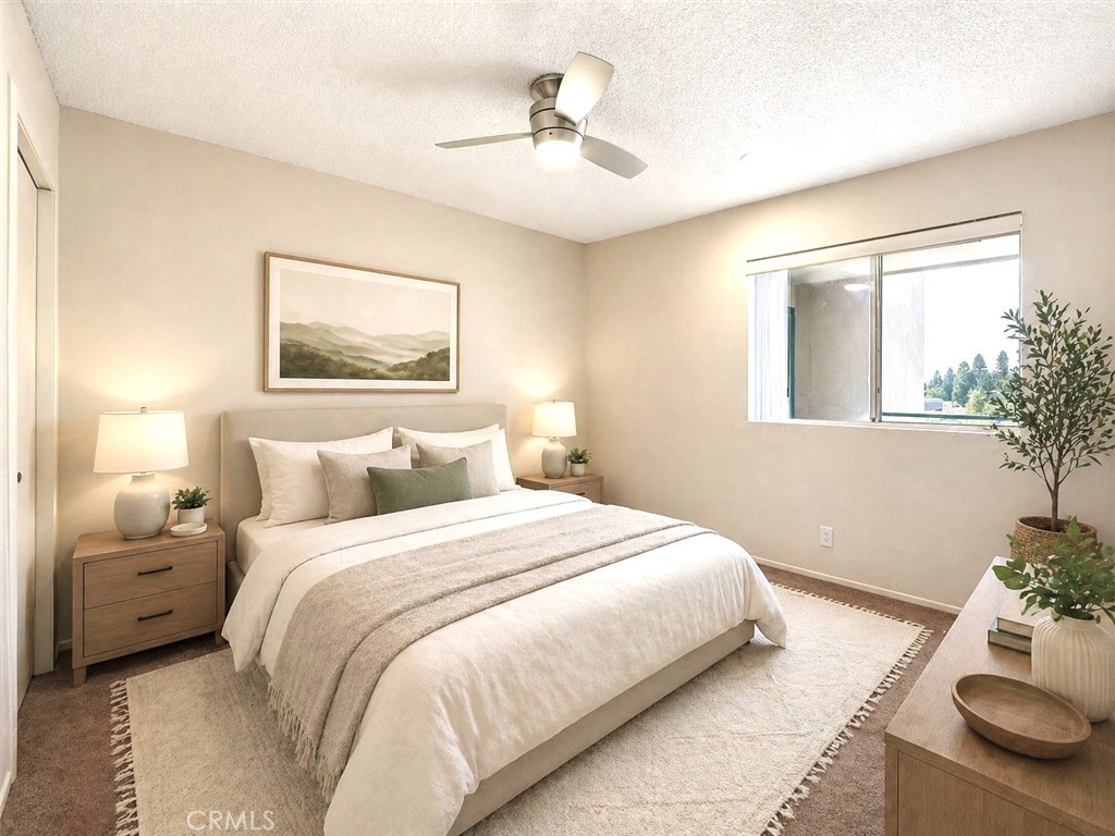 450 East 4th Street, Unit 337 Santa Ana, CA 92701 - Photo 15 of 26 a bedroom with a bed and a potted plant