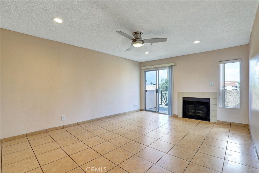 450 East 4th Street, Unit 337 Santa Ana, CA 92701 - Photo 4 of 26 an empty room with windows and fireplace