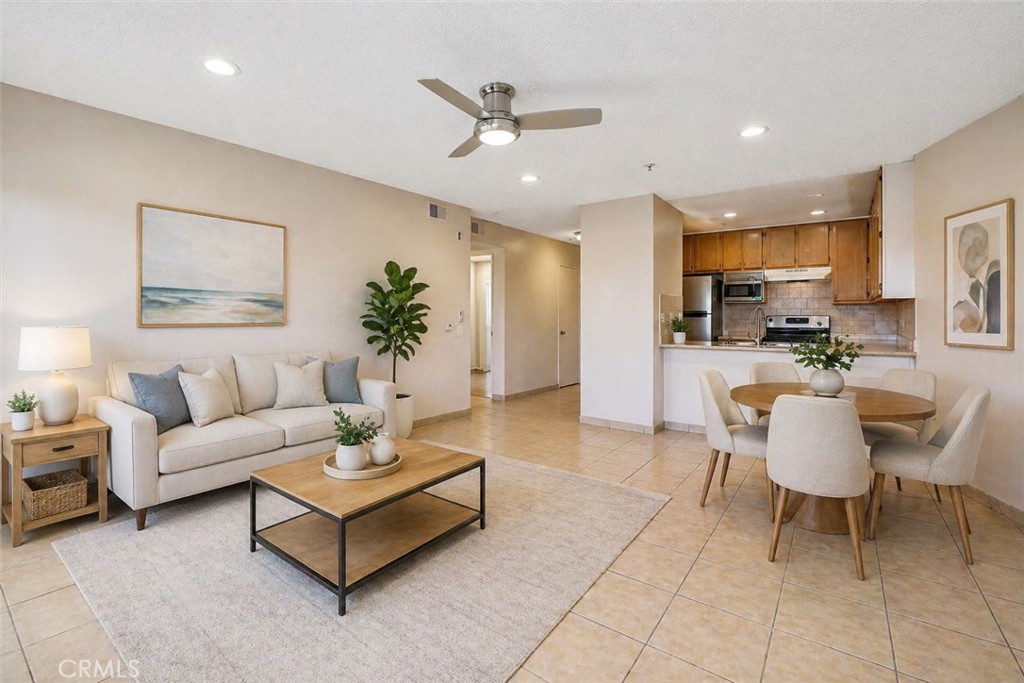450 East 4th Street, Unit 337 Santa Ana, CA 92701 - Photo 5 of 26 a living room with furniture kitchen view and a chandelier