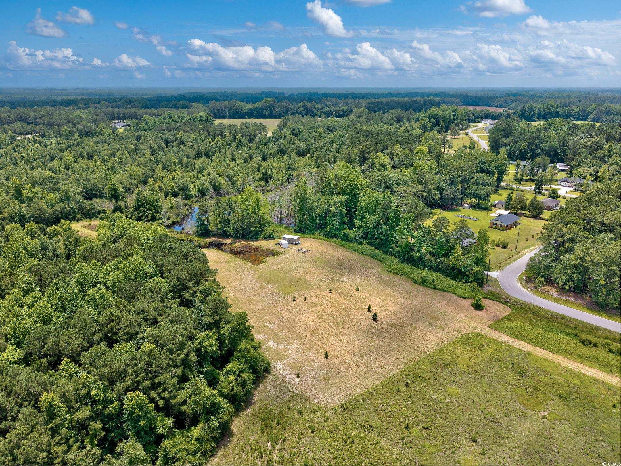 214 Allsbrook Road Loris, SC 29569 - Photo 10 of 15 Aerial view of property and surrounding area with a forest and rural landscape