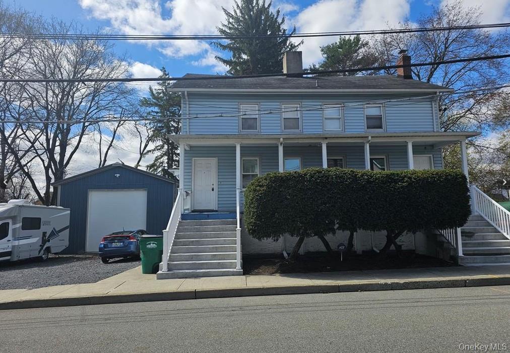 49 Beacon Street, Unit UPPER APARTMENT Beacon, NY 12508 - Photo 1 of 1 a view of house with a yard