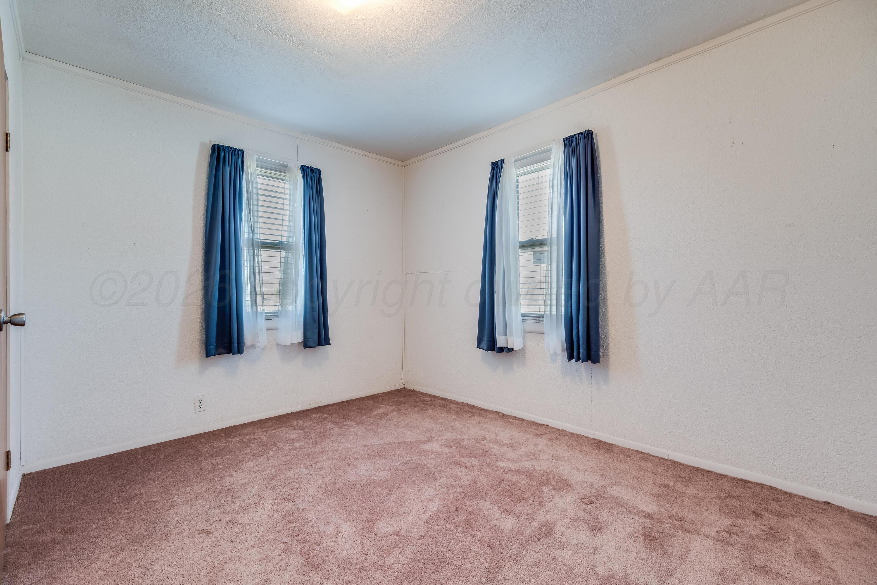 106 South Canadian Street Wheeler, TX 79096 - Photo 11 of 20 a view of an empty room with window