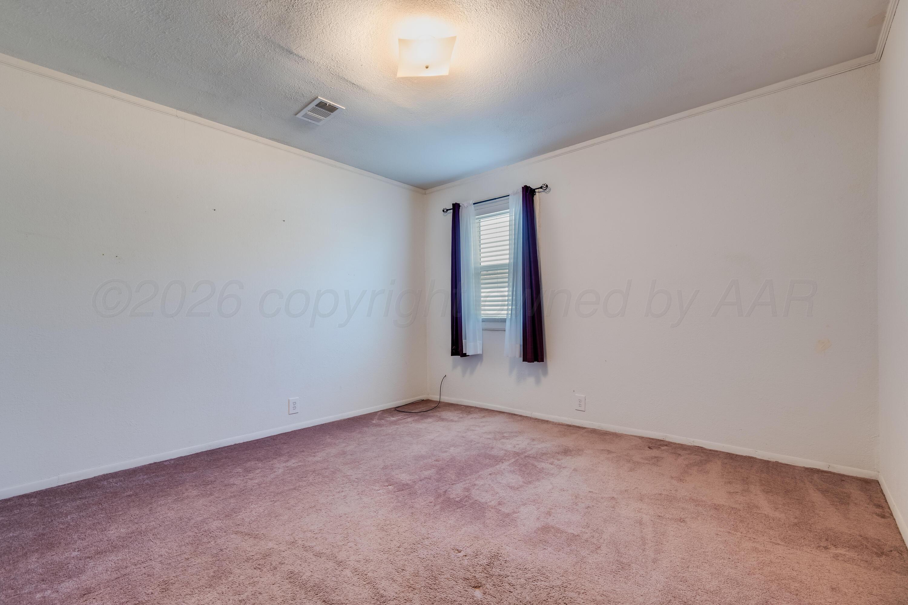 106 South Canadian Street Wheeler, TX 79096 - Photo 17 of 20 an empty room with windows