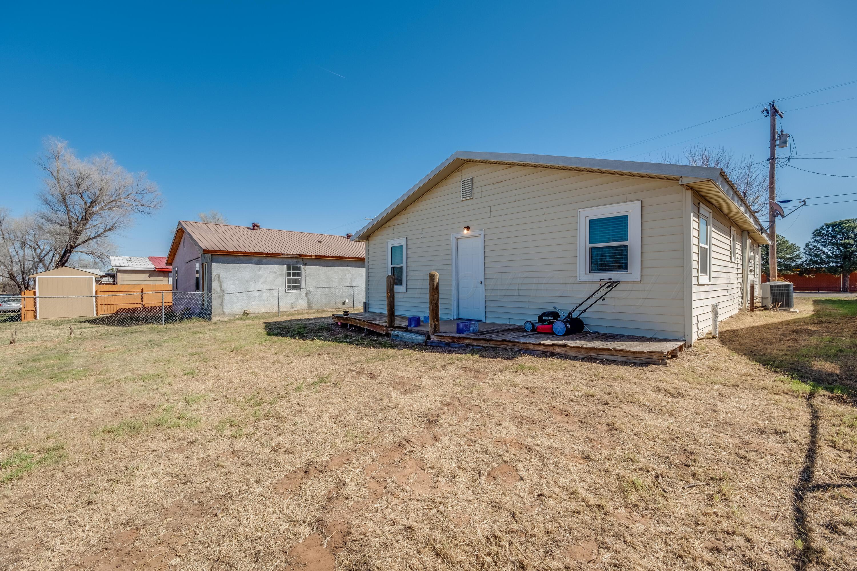 106 South Canadian Street Wheeler, TX 79096 - Photo 20 of 20 a view of a house with a backyard