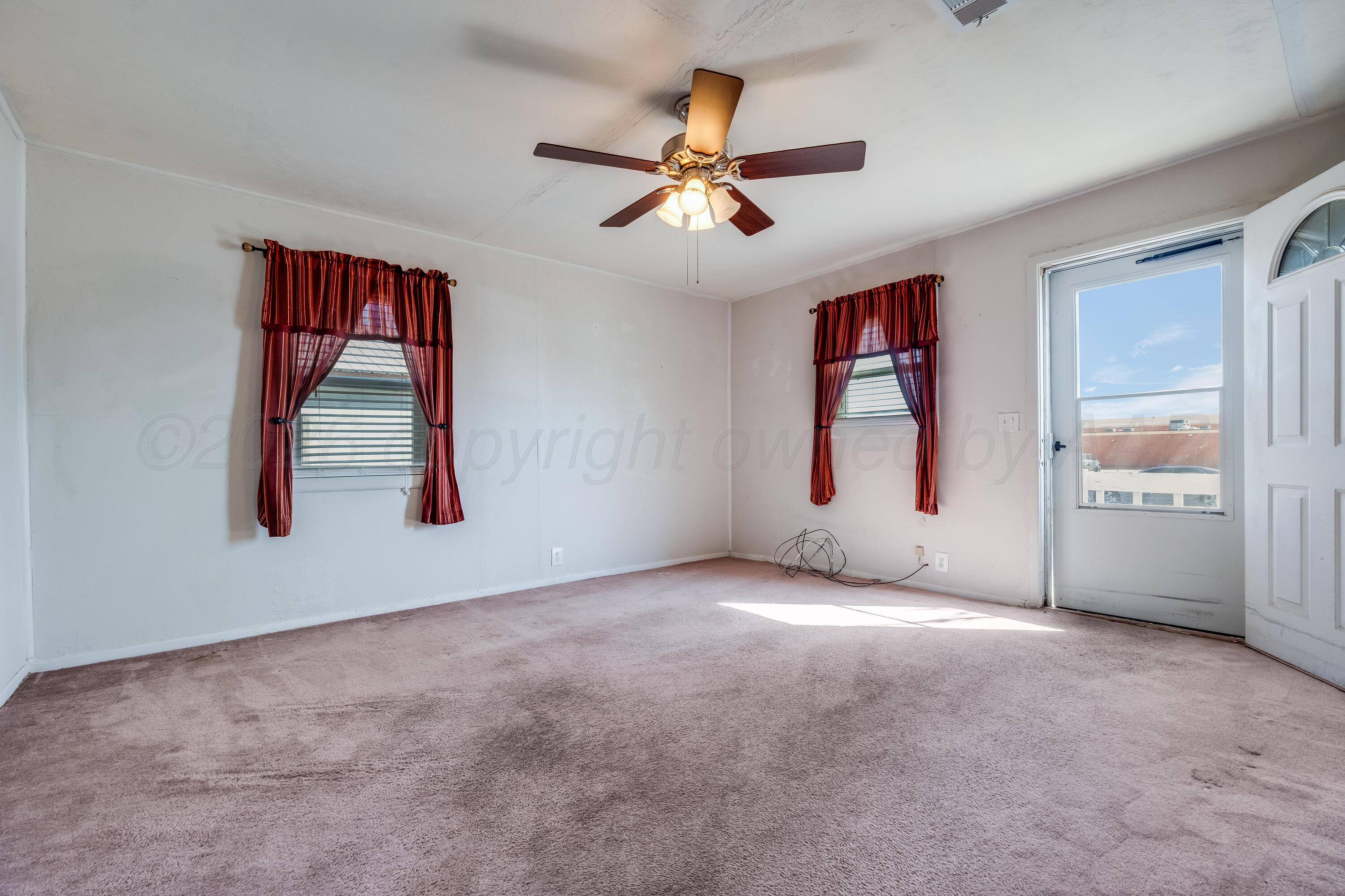 106 South Canadian Street Wheeler, TX 79096 - Photo 6 of 20 a view of an empty room with window