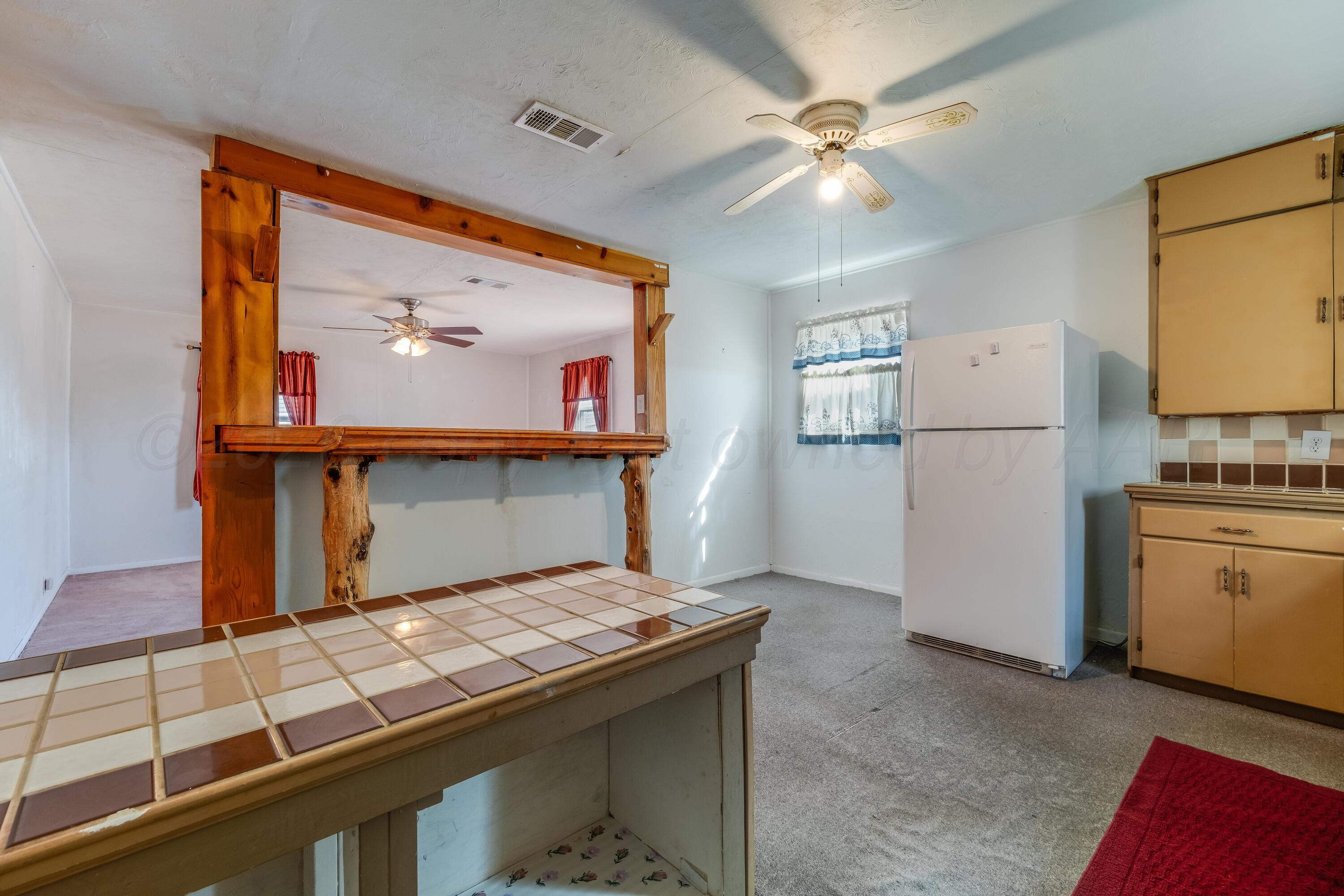 106 South Canadian Street Wheeler, TX 79096 - Photo 10 of 20 a room with storage and utility