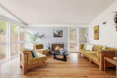 a view of a room with wooden floor and iron swing