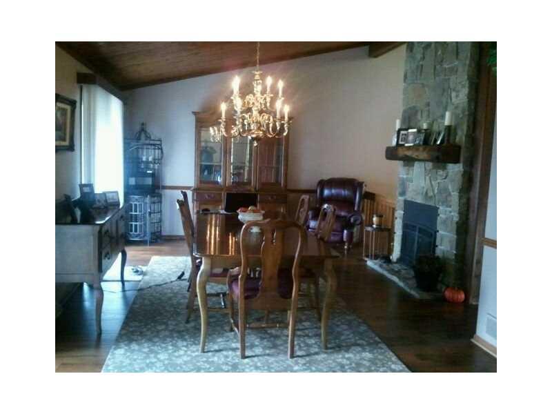 143 Whitestown Road Harmony, PA 16037 - Photo 9 of 16 Dining Room. Wood burning Fireplace and Hardwood Floors throughout