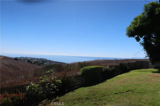 a view of a chairs and table in patio