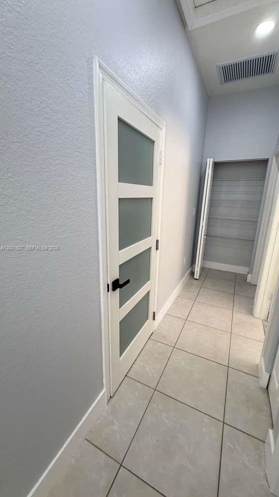 2120 Northeast 37th Road, Unit 1 Homestead, FL 33033 - Photo 21 of 30 a view of an empty room with a fireplace and cabinet