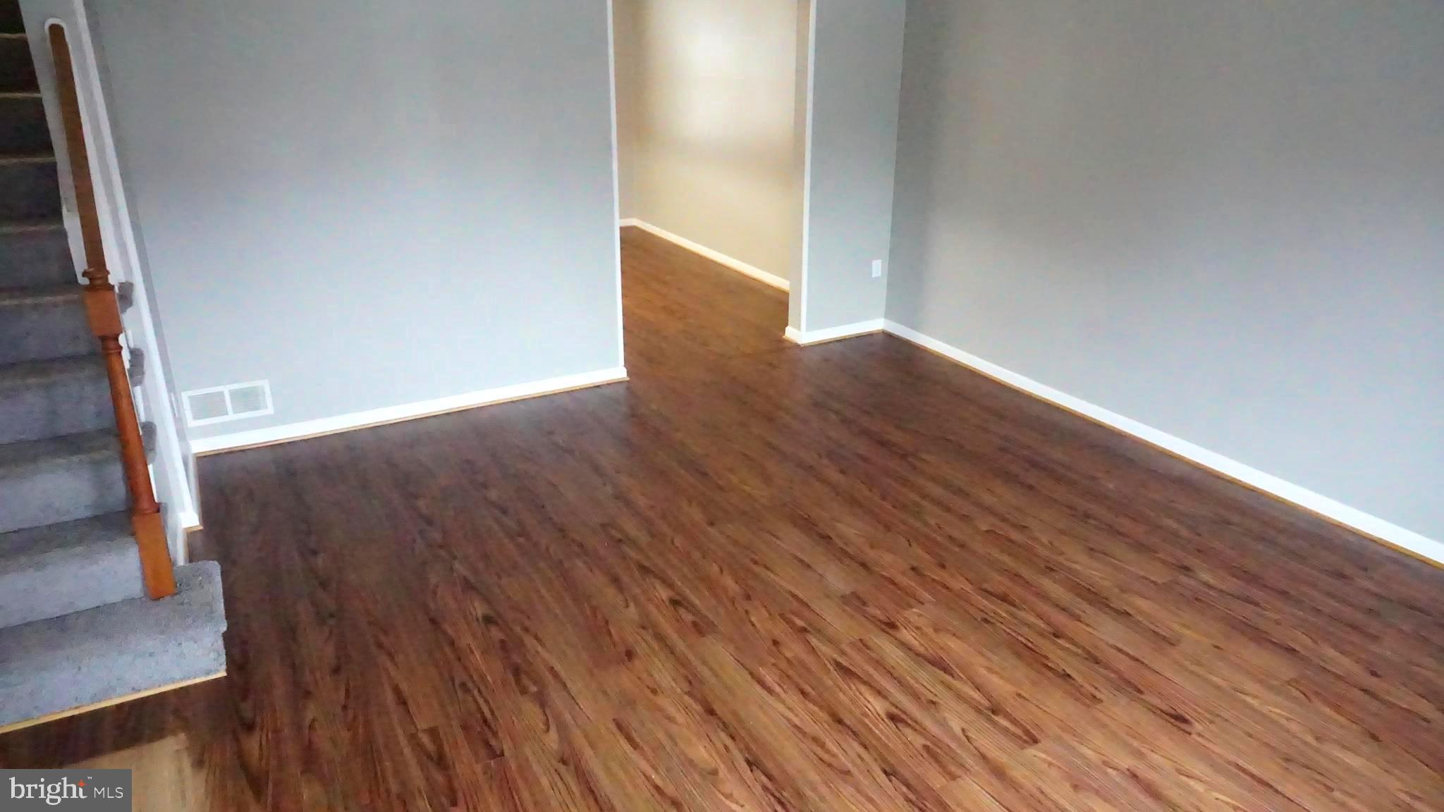 8155 Kavanagh Road Baltimore, MD 21222 - Photo 11 of 24 Beautiful Laminate Floors over Hardwood