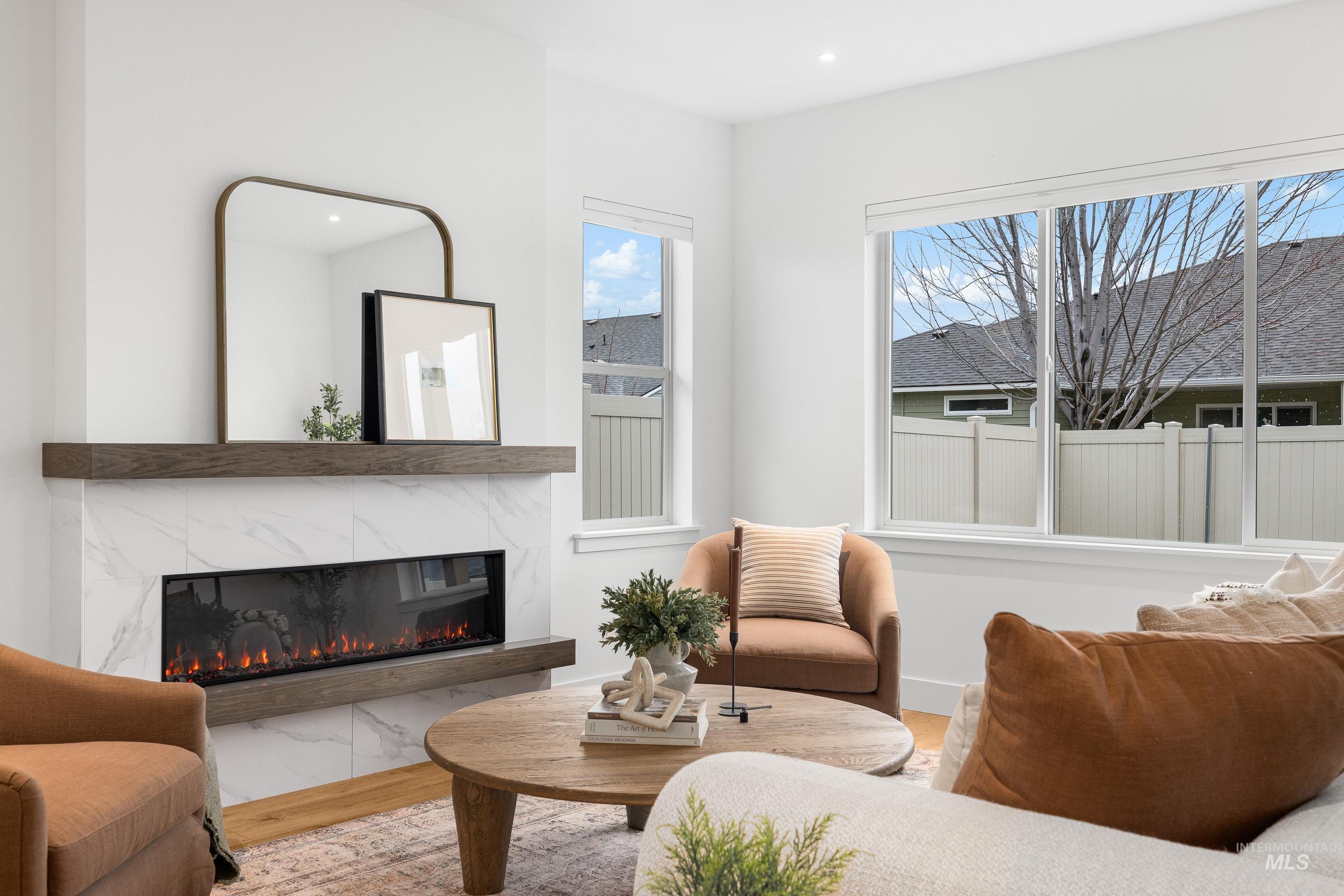 3071 North Lapis Avenue Meridian, ID 83646 - Photo 27 of 50 Sitting room with a high end fireplace, wood finished floors, and recessed lighting