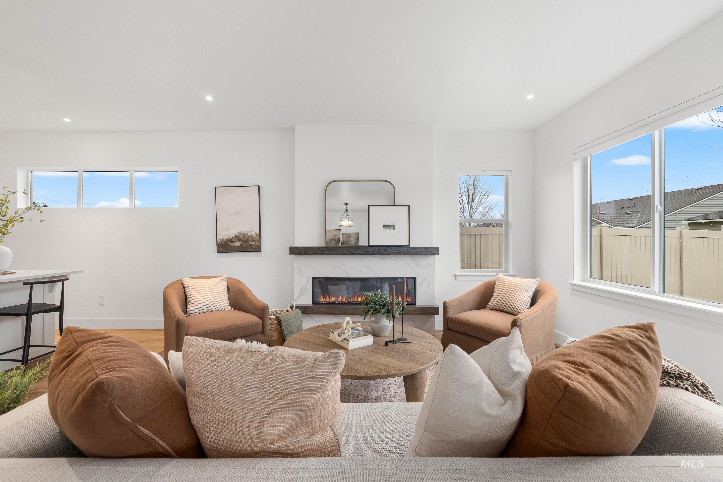 3071 North Lapis Avenue Meridian, ID 83646 - Photo 28 of 50 Living area featuring recessed lighting, a premium fireplace, and wood finished floors