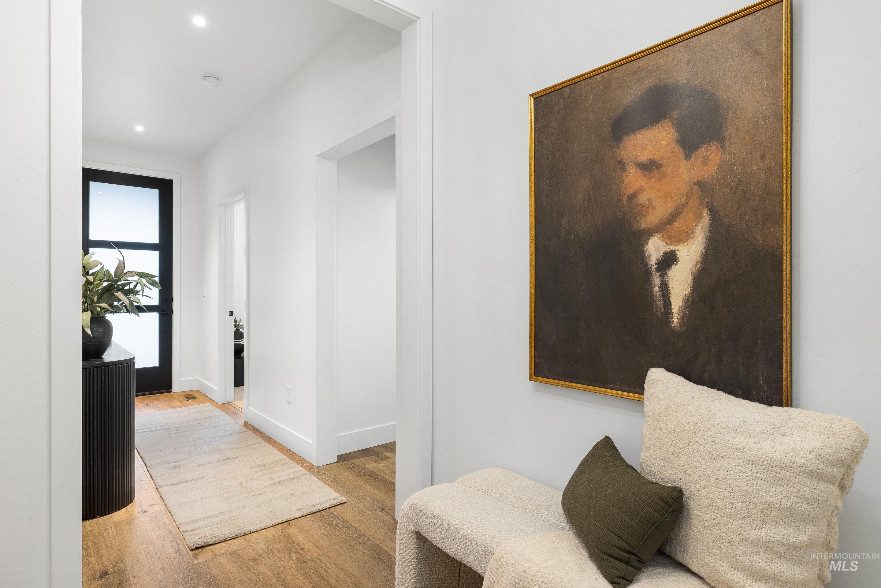 3071 North Lapis Avenue Meridian, ID 83646 - Photo 4 of 50 Hallway with light wood-style flooring and recessed lighting