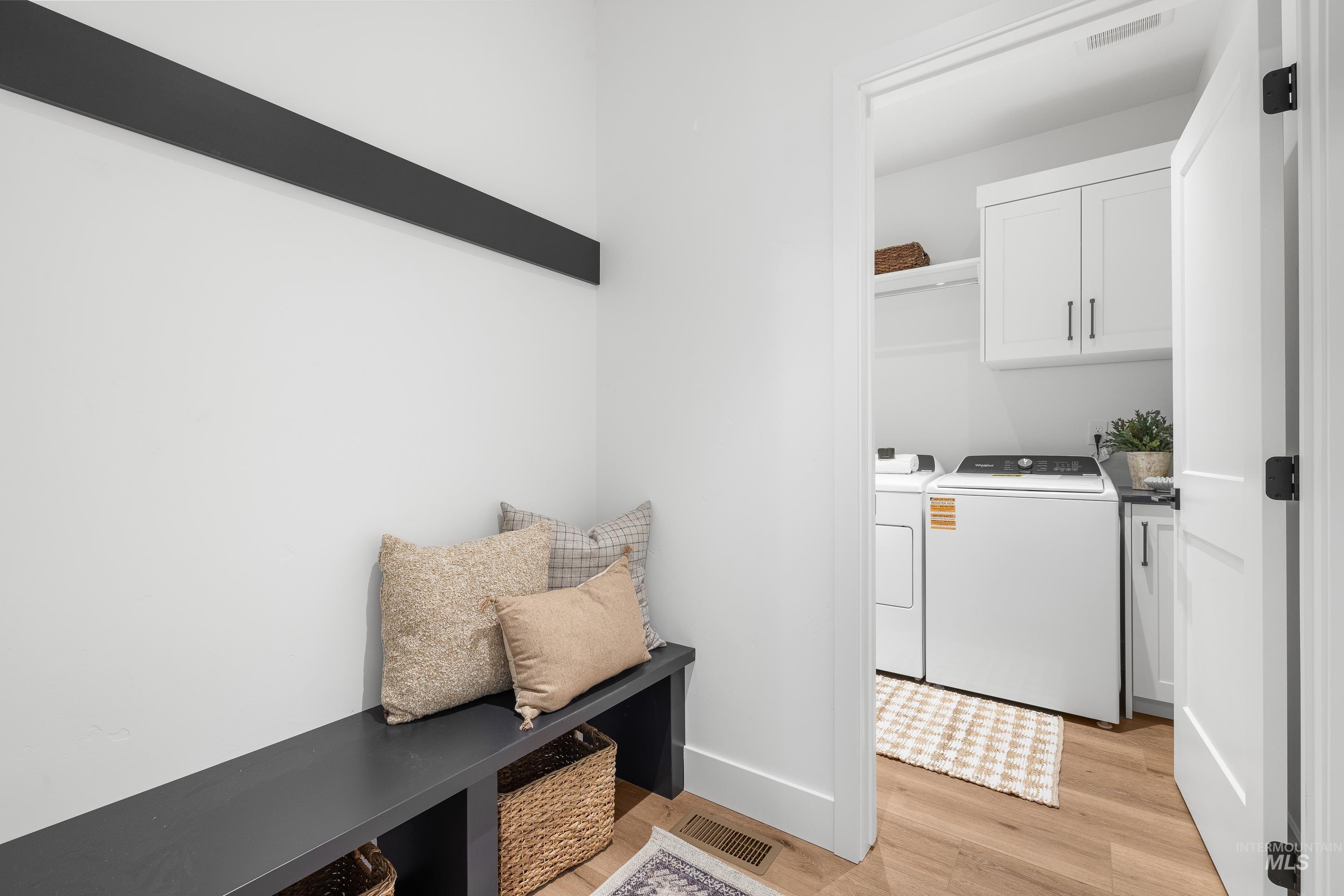 3071 North Lapis Avenue Meridian, ID 83646 - Photo 40 of 50 Mudroom with light wood-style flooring and washer and dryer