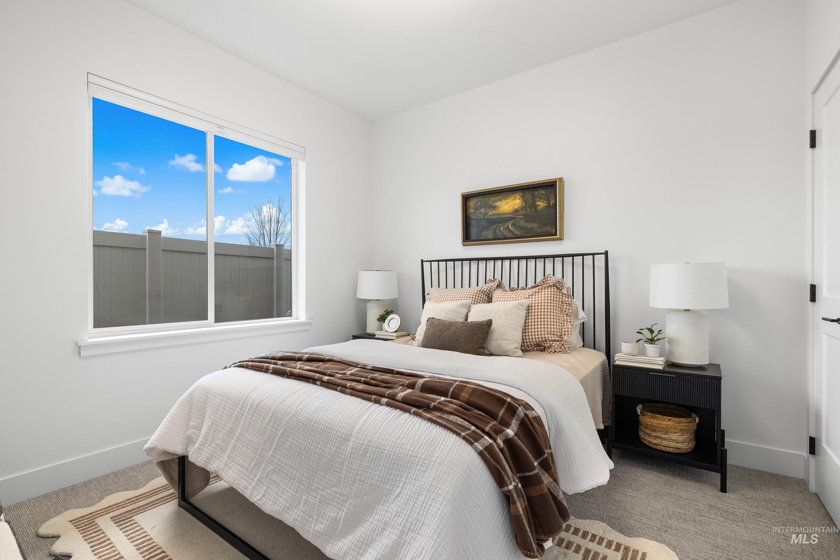 3071 North Lapis Avenue Meridian, ID 83646 - Photo 42 of 50 Bedroom featuring carpet floors and baseboards