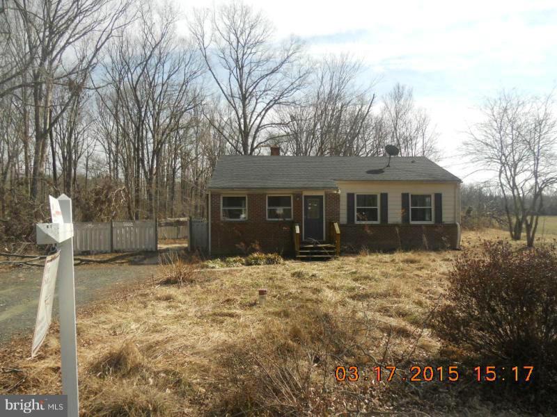 1249 Wrighton Road Lothian, MD 20711 - Photo 1 of 12 a front view of a house with a yard