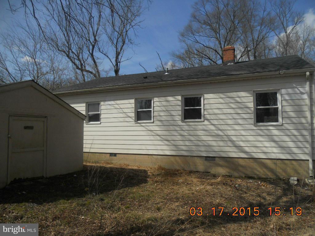 1249 Wrighton Road Lothian, MD 20711 - Photo 9 of 12 a view of a house with a yard