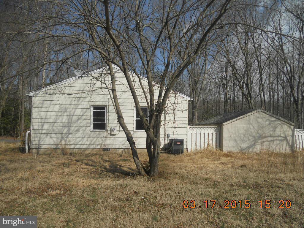 1249 Wrighton Road Lothian, MD 20711 - Photo 10 of 12 a view of a house with a yard