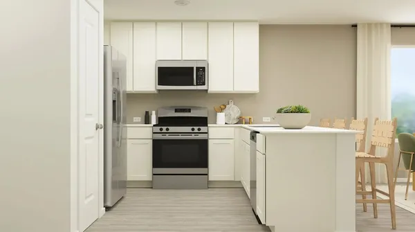 a kitchen with stainless steel appliances a stove a microwave and a refrigerator