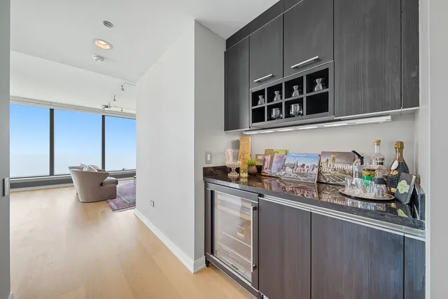 a kitchen with stainless steel appliances cabinets and a counter top space