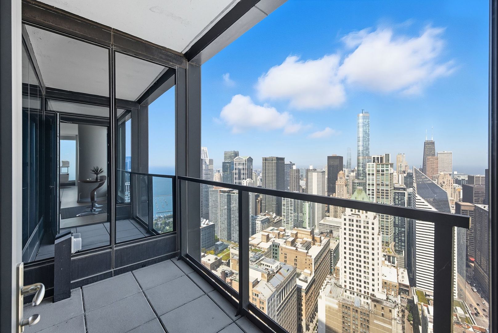60 East Monroe Street, Unit 5601 Chicago, IL 60603 - Photo 30 of 50 a view of a balcony with wooden floor