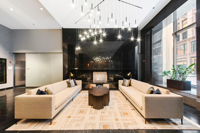 60 East Monroe Street, Unit 5601 Chicago, IL 60603 - Photo 43 of 50 a living room with furniture and a chandelier