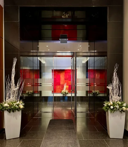 a view of people sitting in front of retail shops