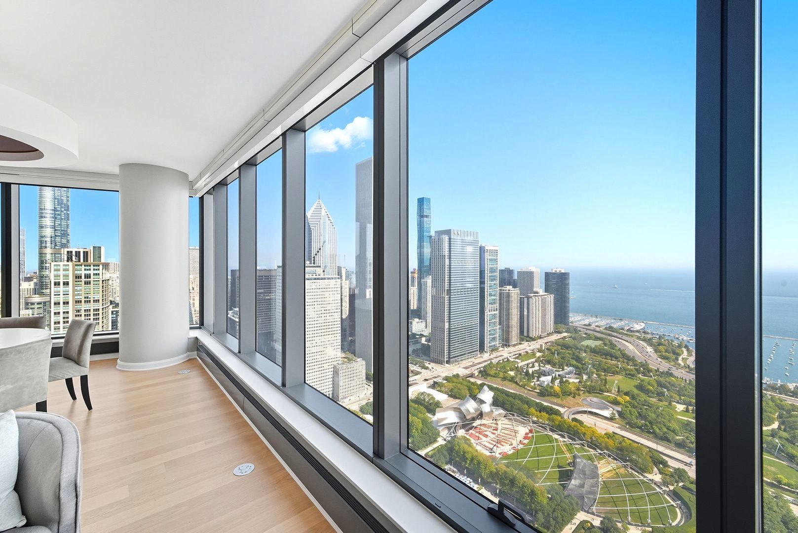 60 East Monroe Street, Unit 5601 Chicago, IL 60603 - Photo 7 of 50 a view of a balcony with floor to ceiling windows with wooden floor