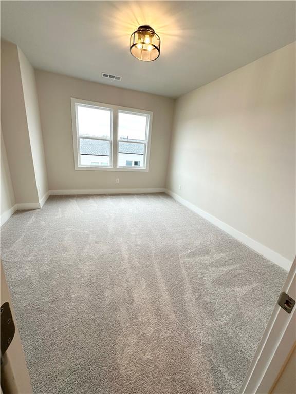 1237 Waldon Crossing Cumming, GA 30041 - Photo 24 of 29 an empty room with a window