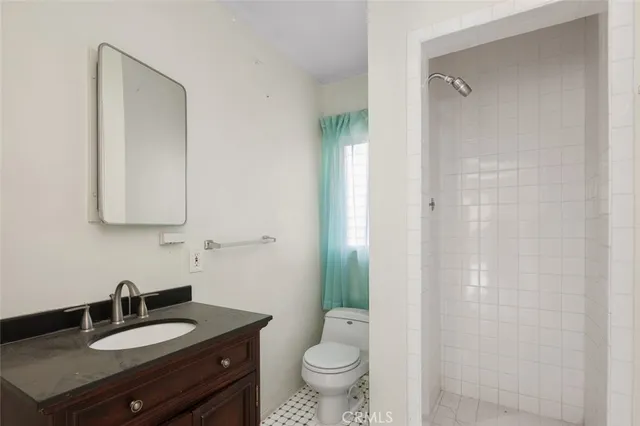 a backyard of a house with plants and trees