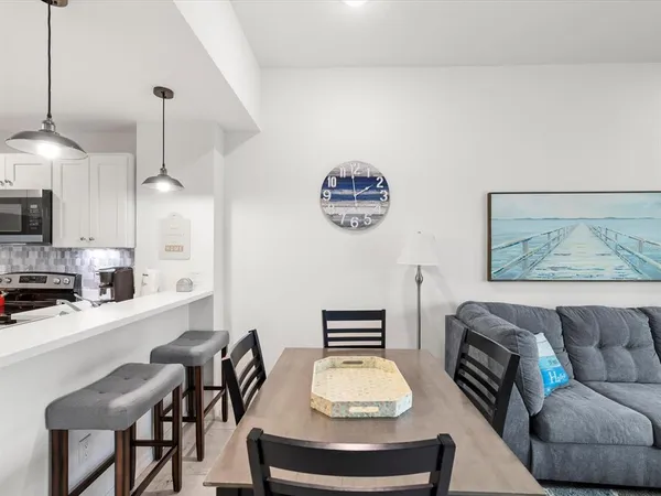 a view of hallway with wooden floor