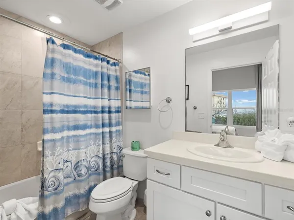 an aerial view of a house with a lake view