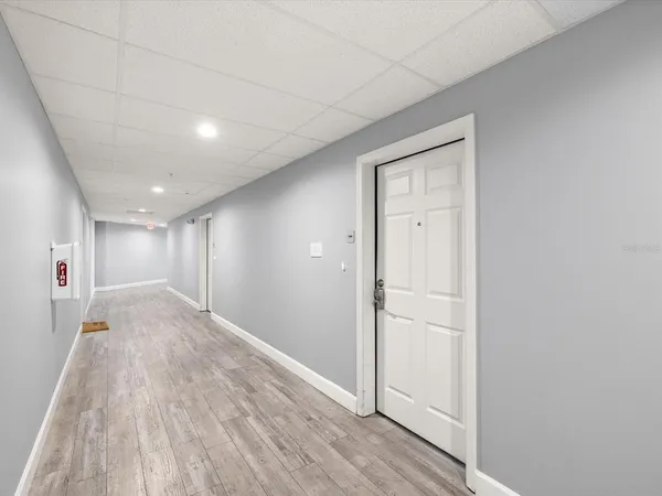 an aerial view of a city with lots of residential buildings lake and ocean view